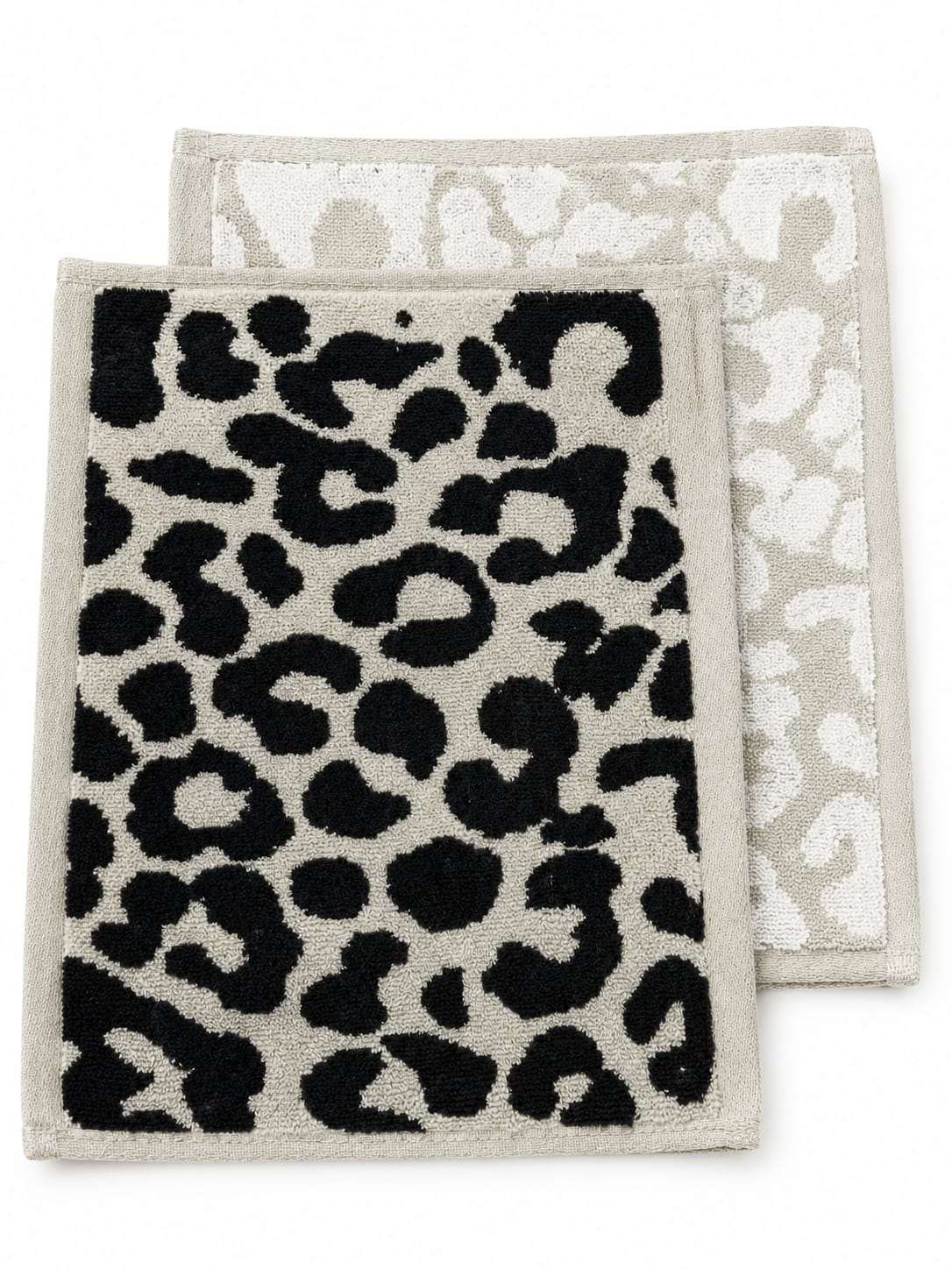 Close-up of the woven cheetah print in black and beige cotton pile